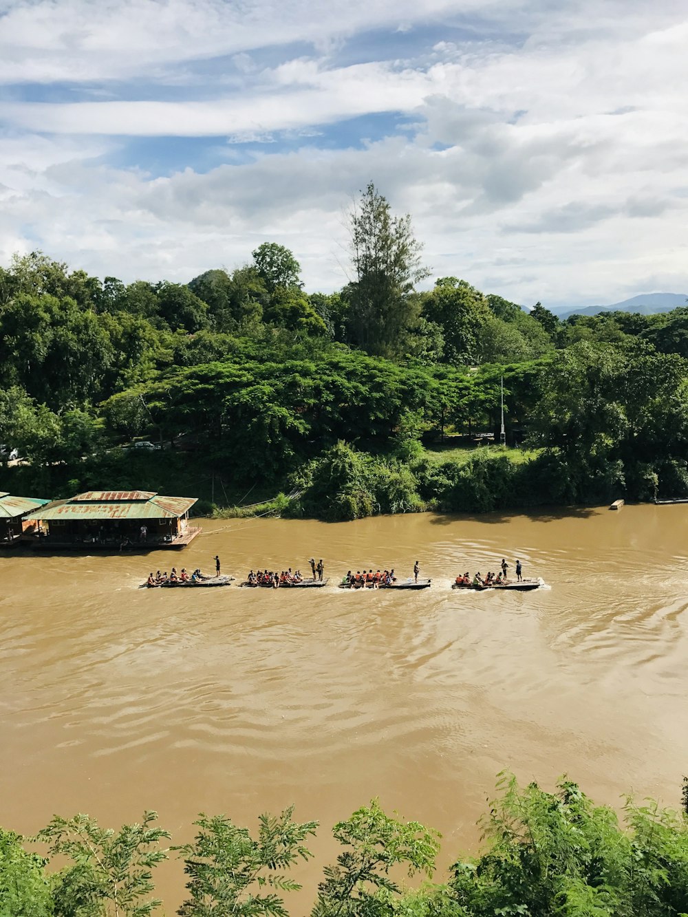 people riding boats