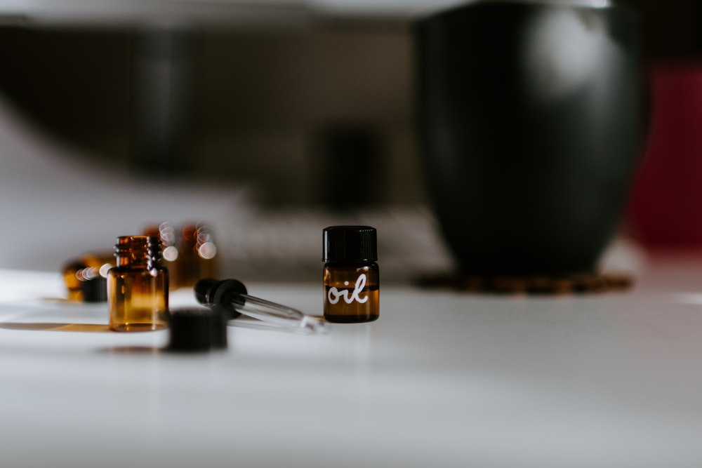 selective focus photography of brown oil bottles