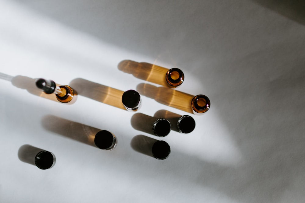 brown glass bottles on white surface