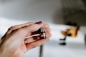 person holding brown glass bottle