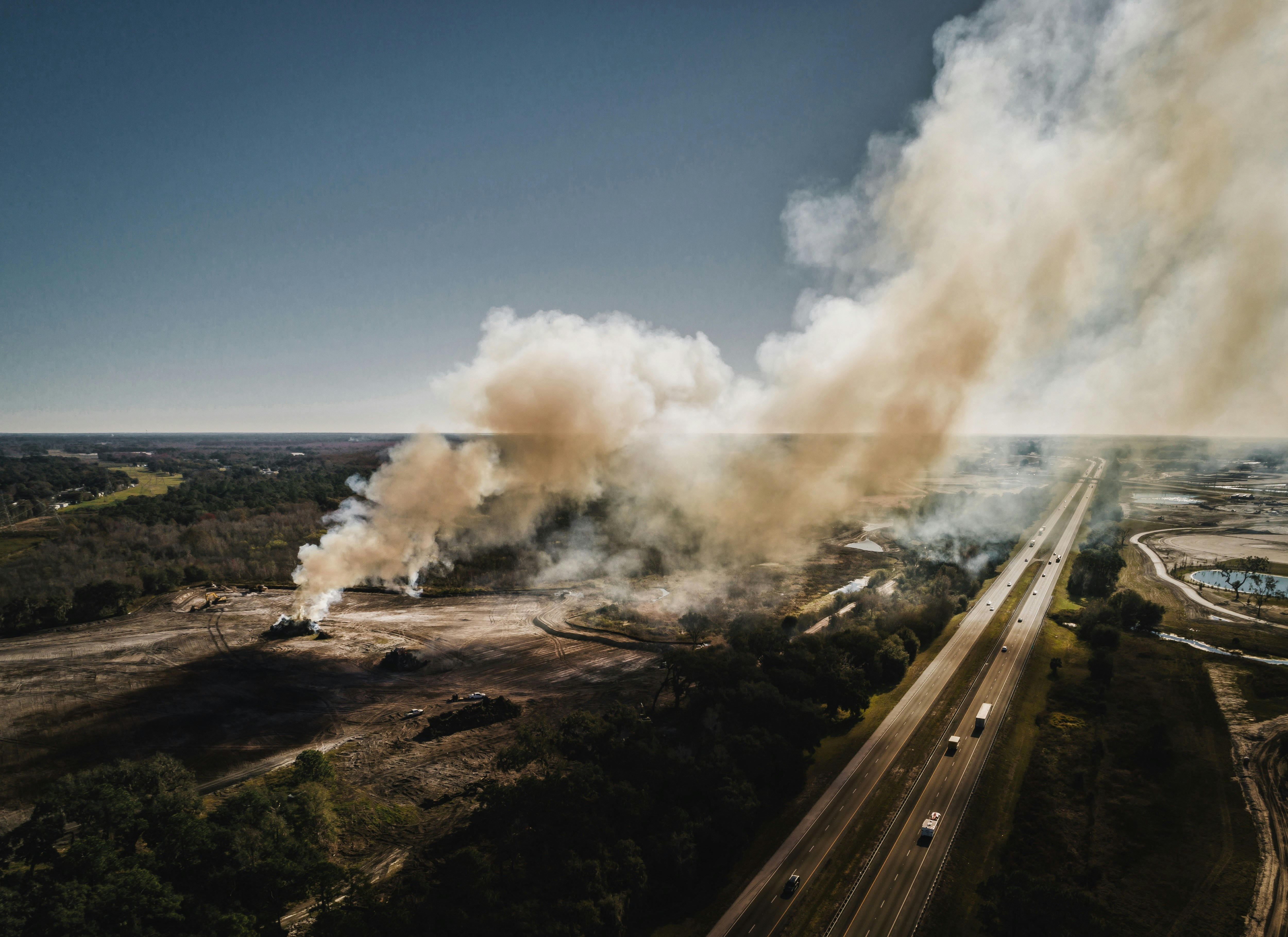 aerial photography of smoke near road