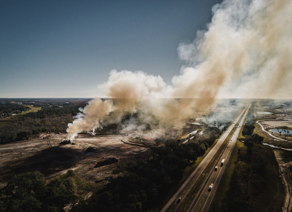 aerial photography of smoke near road