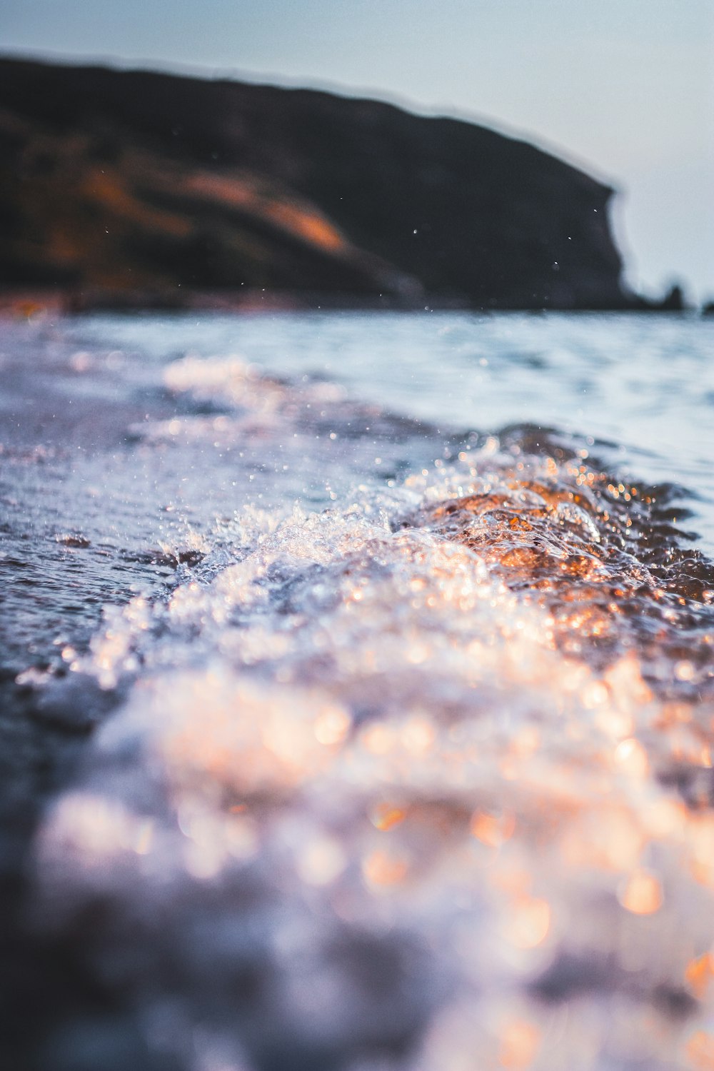 shallow focus photo of body of water