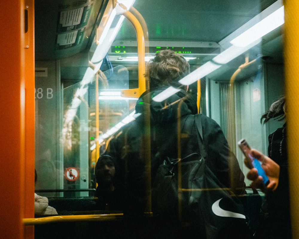 person standing in the train