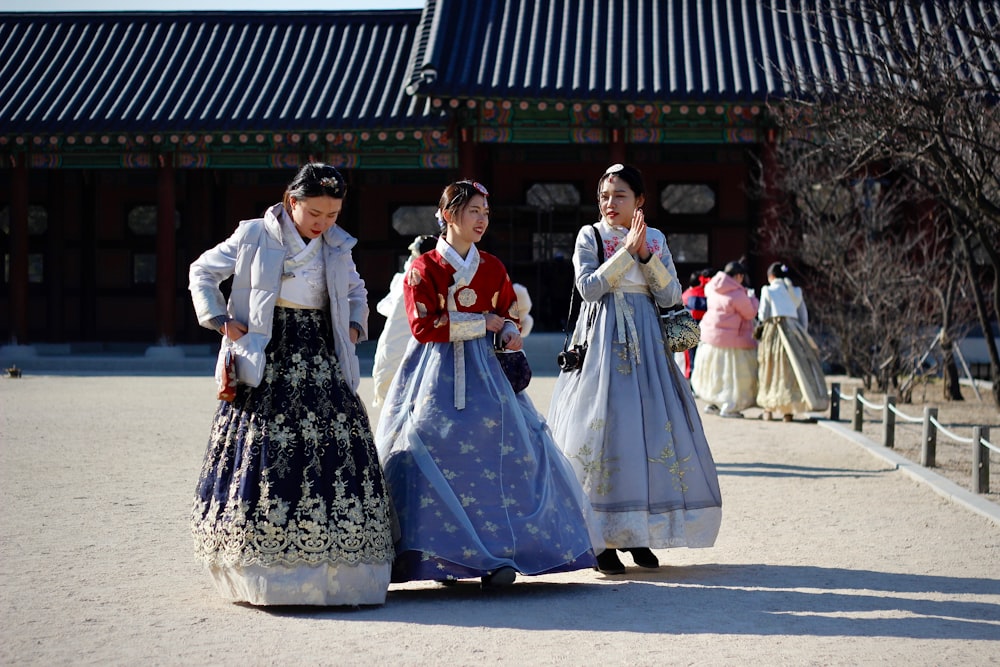 woman wearing white and black dress walking on street