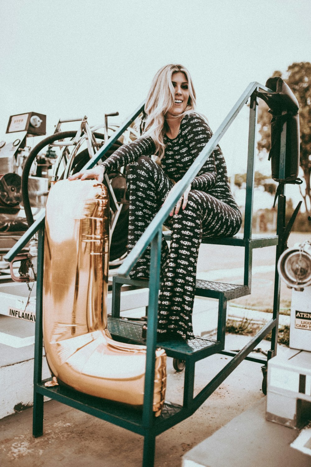 woman sitting on step ladder