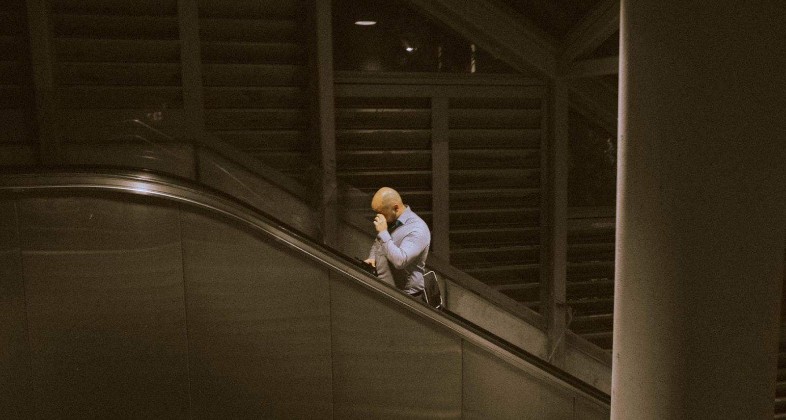 Fujifilm X-Pro2 + Fujifilm XF 23mm F2 R WR sample photo. Man riding on escalator photography