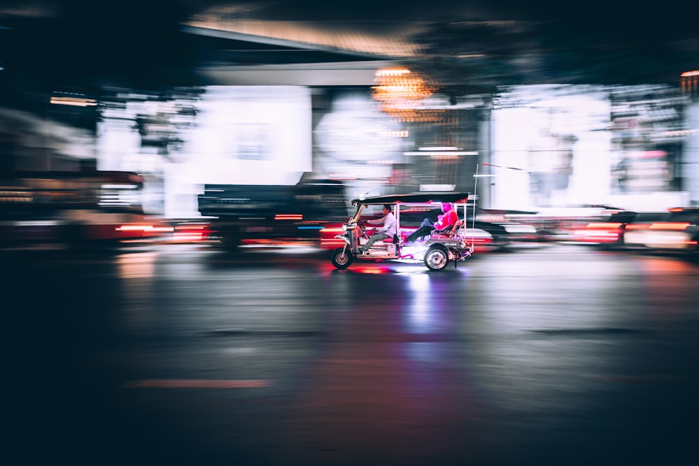 time-lapse photography of auto rickshaw