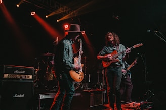 group of men playing guitars