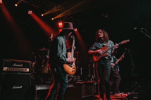 group of men playing guitars