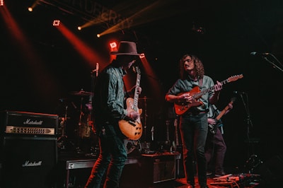 group of men playing guitars