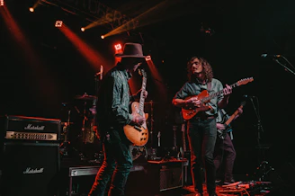 group of men playing guitars