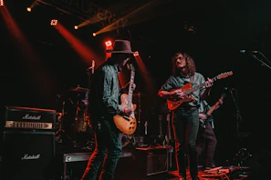 group of men playing guitars