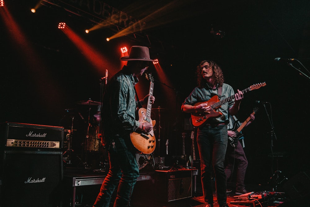 group of men playing guitars