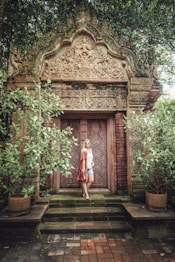 woman standing behind door
