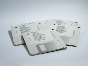 four MacBook diskettes