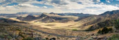 A panoramic shot of raw land in Dateland, AZ, showing open space and distant mountains.