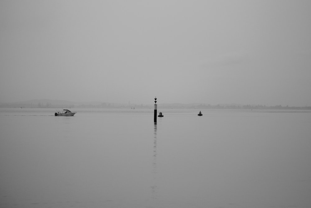 white power boat in the middle of the water