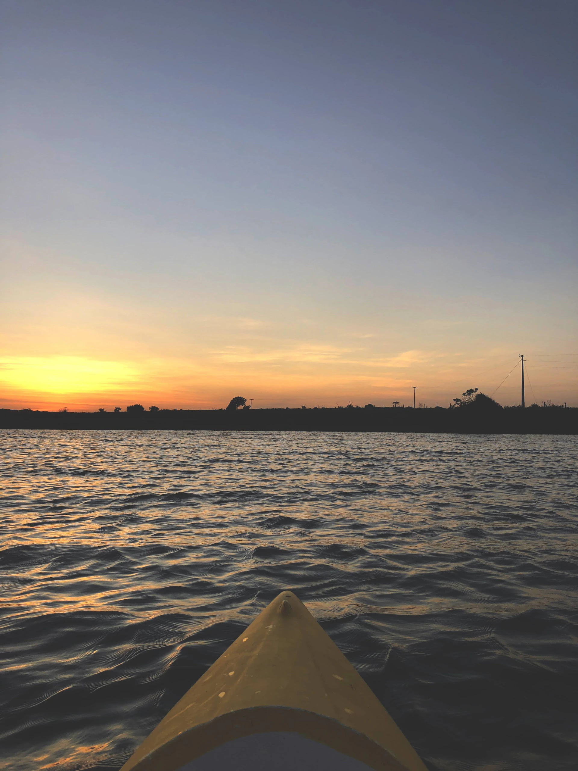 woman wearing yellow long-sleeved dress under white clouds and blue sky during daytime