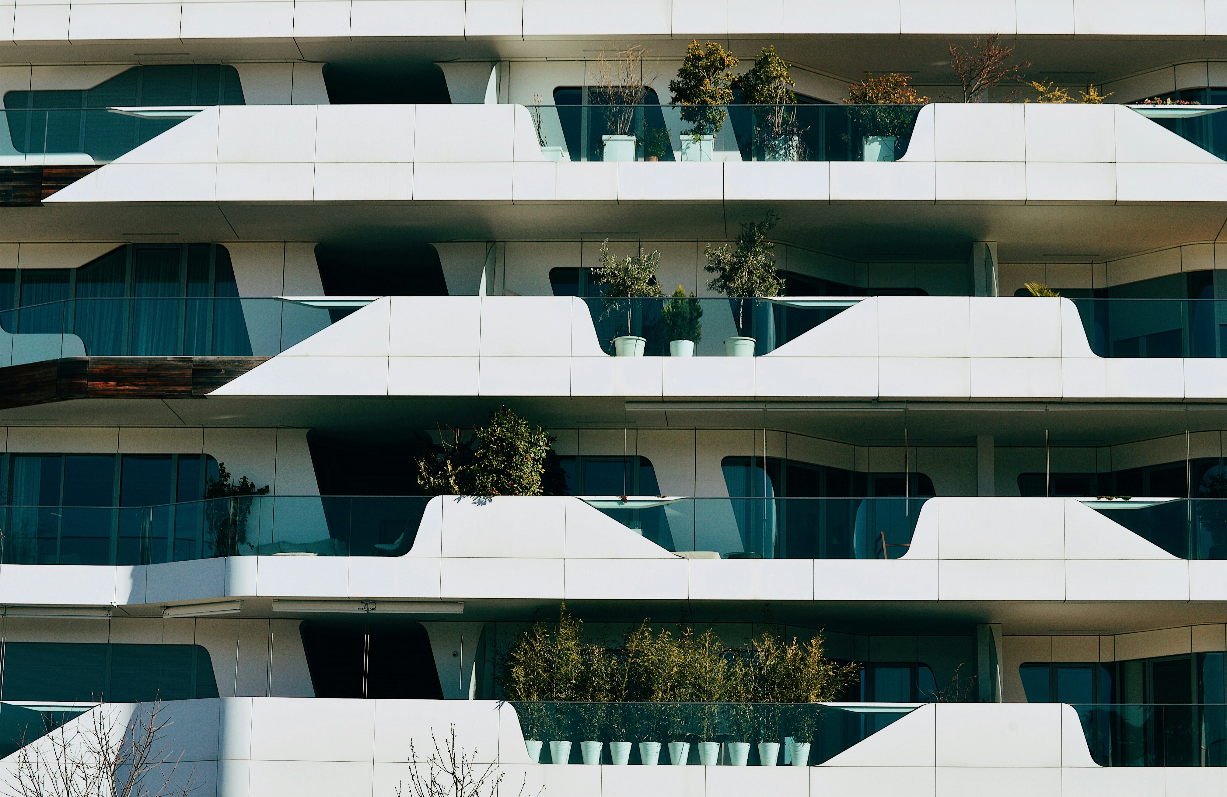 White and blue-colored four stories building