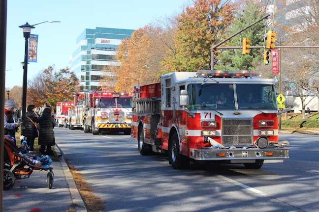 Fire trucks lined up along the main street of Quapaw at sunset.