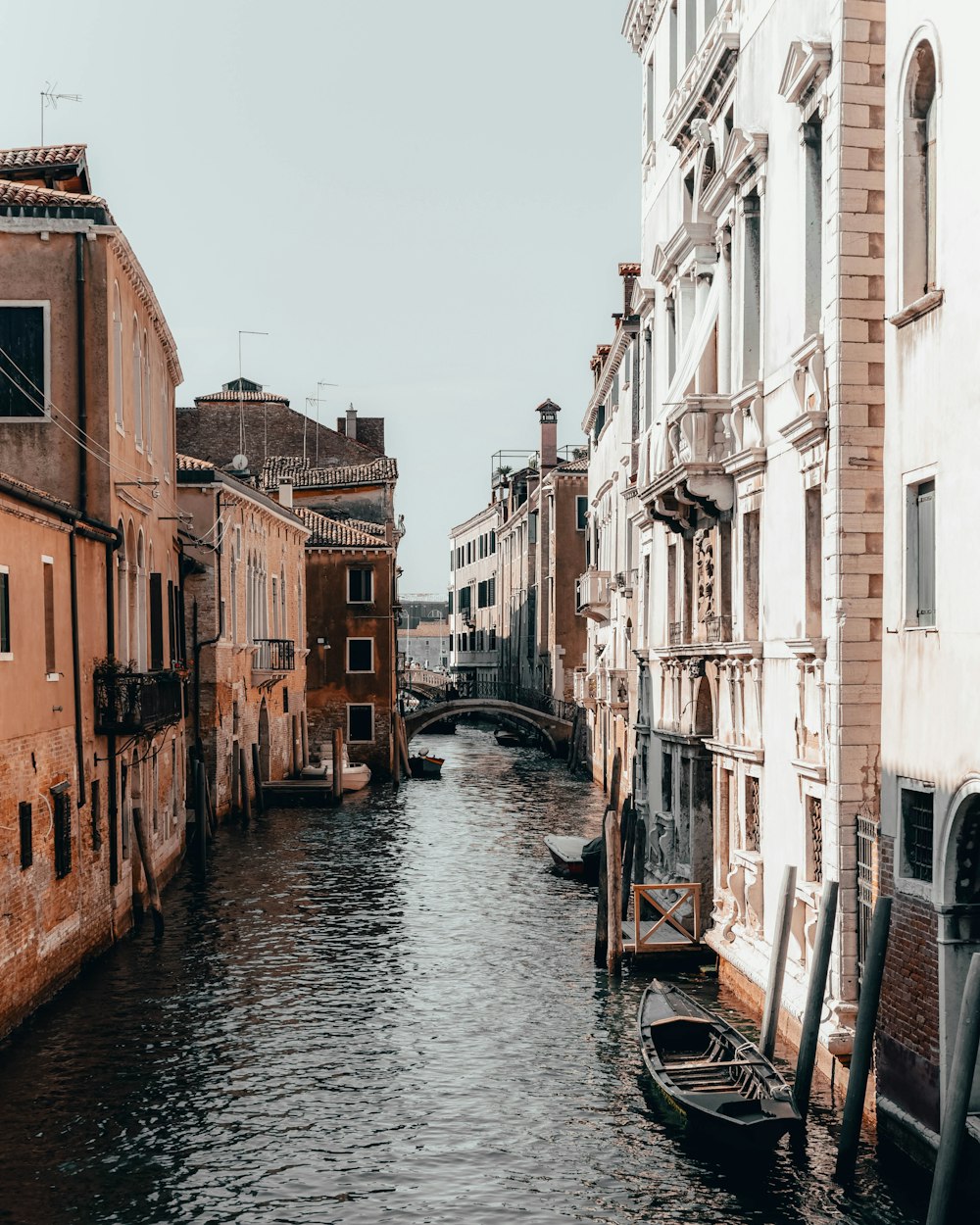 river between buildings at daytime