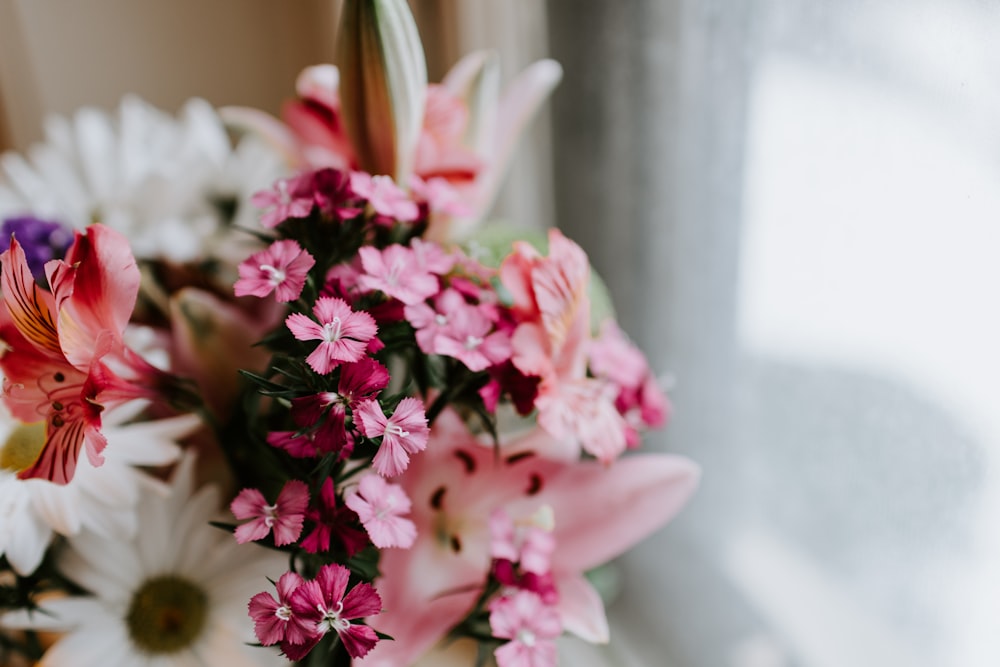 assorted flowers in selective focus photography