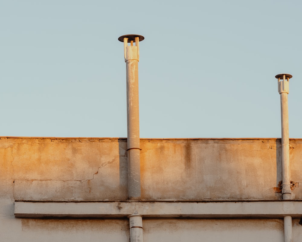 gray buildings with two chimneys