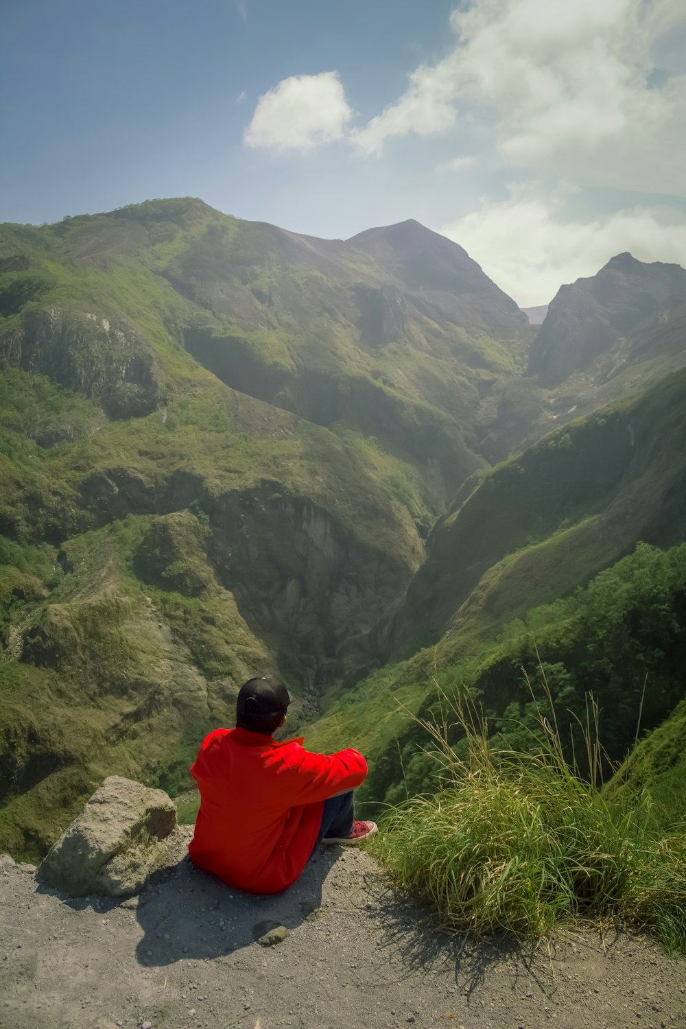 person sitting on mountain