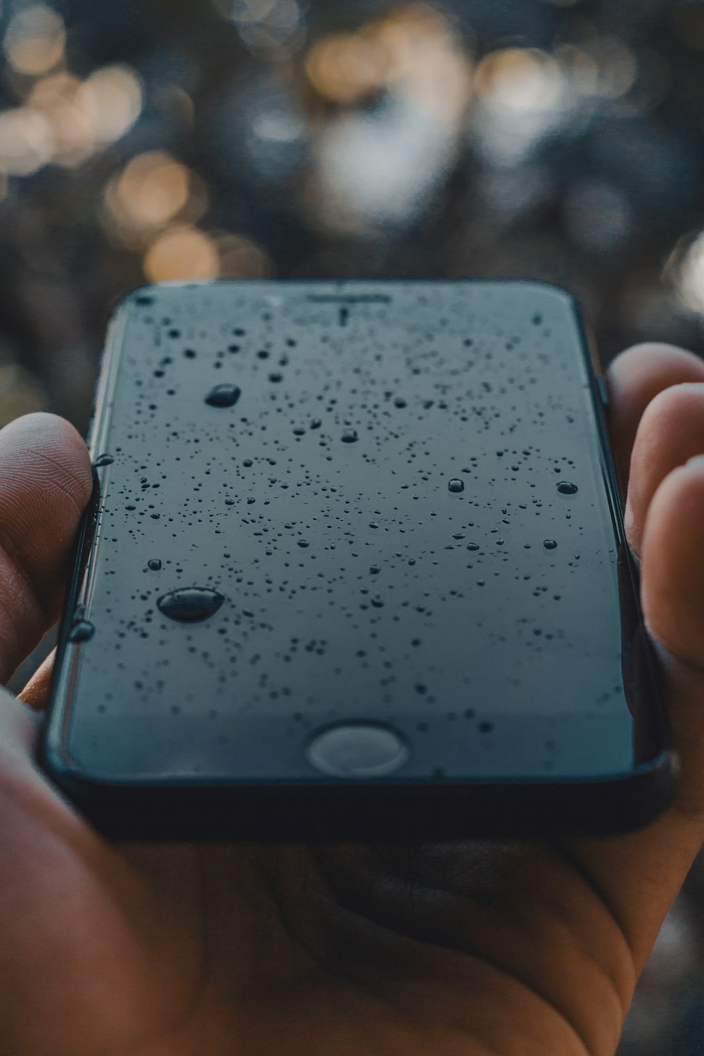 black iPhone with water dew