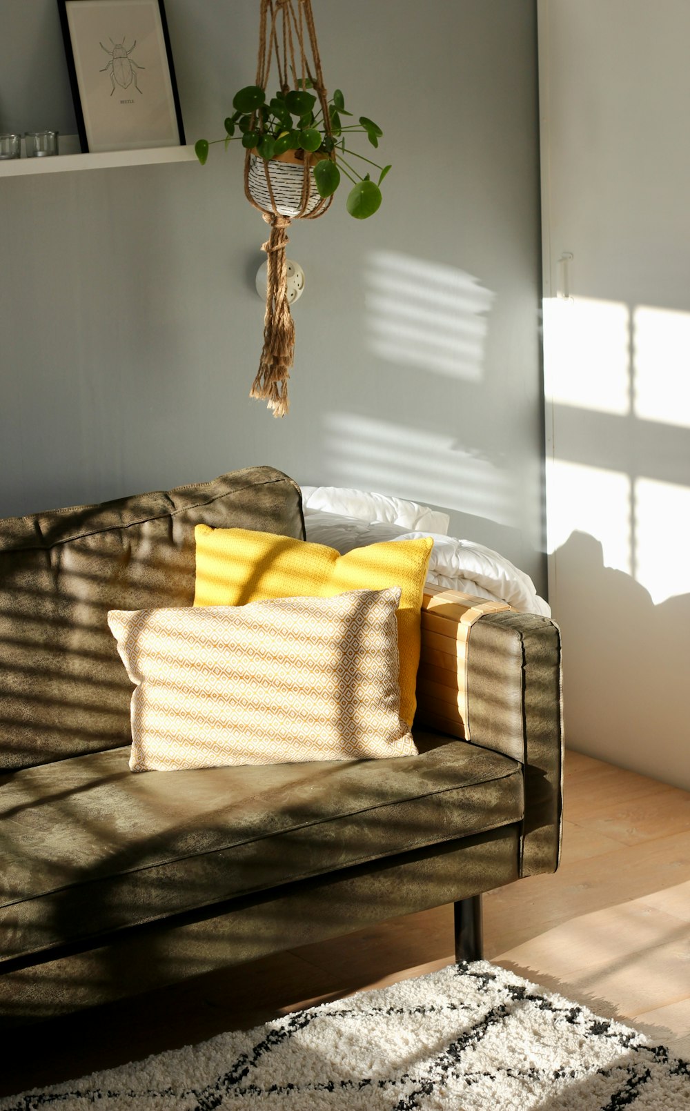 two white and yellow pillows on gray sofa