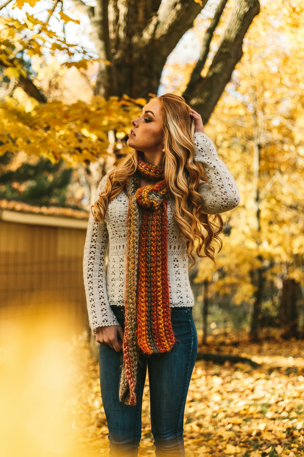 shallow focus photo of woman in white sweater