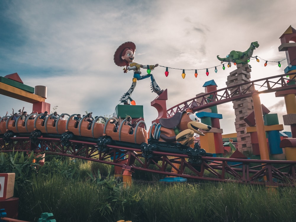 roller coaster passing through rail