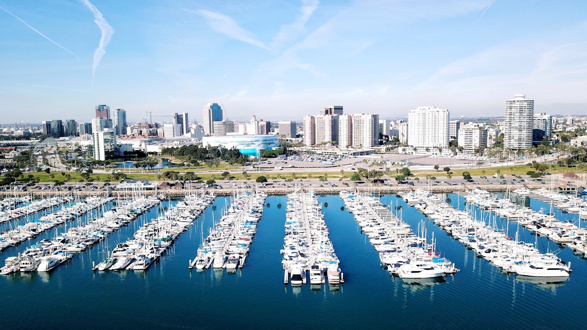 Aerial view of Long Beach marina and downtown skyline showing hundreds of boats with high-rise buildings in the background
