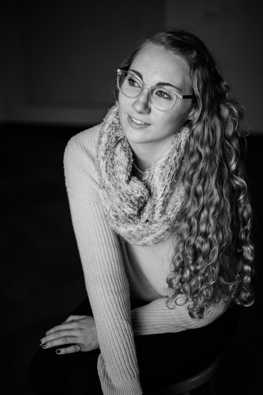 grayscale photography of woman kneeling