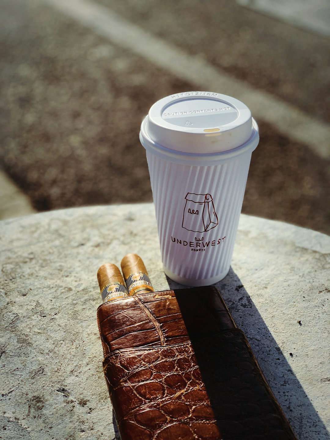 white disposable cup close-up photography