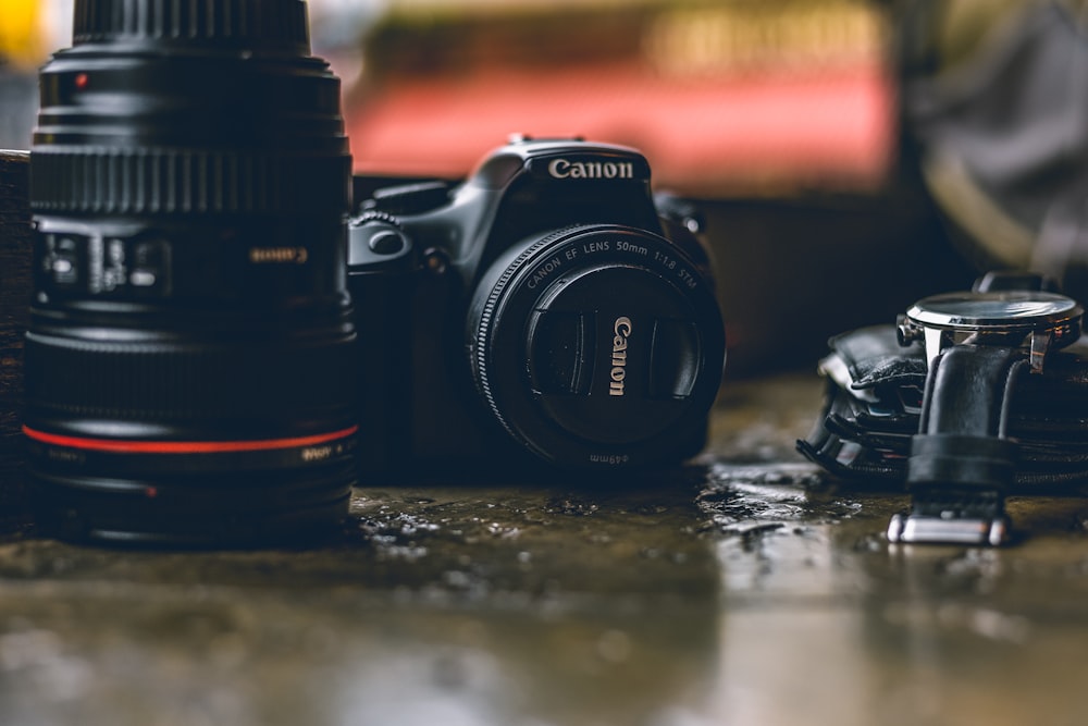 selective focus photo of black Canon DSLR camera