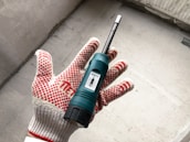 Close-up of hands measuring quality of concrete prefab materials.