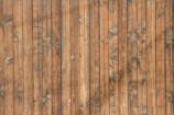 Close-up of a wooden wall panel with natural grain and abstract patterns.