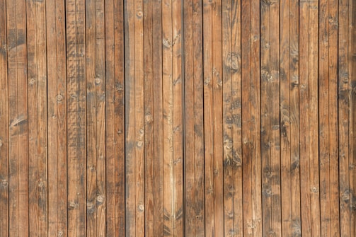Close-up of a wooden wall panel with natural grain and abstract patterns.