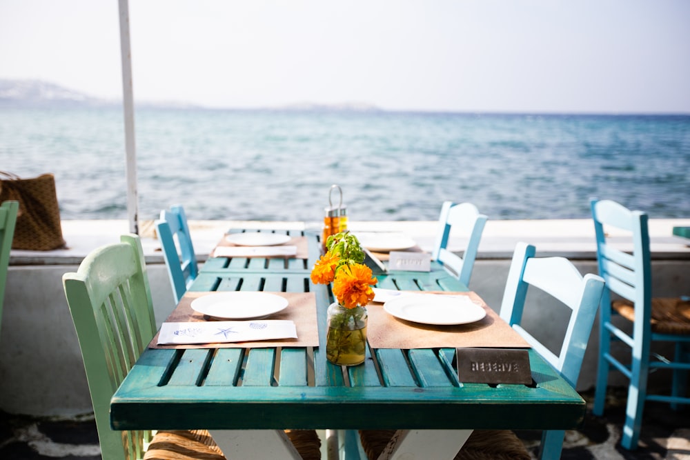 plates on dining tables by the sea