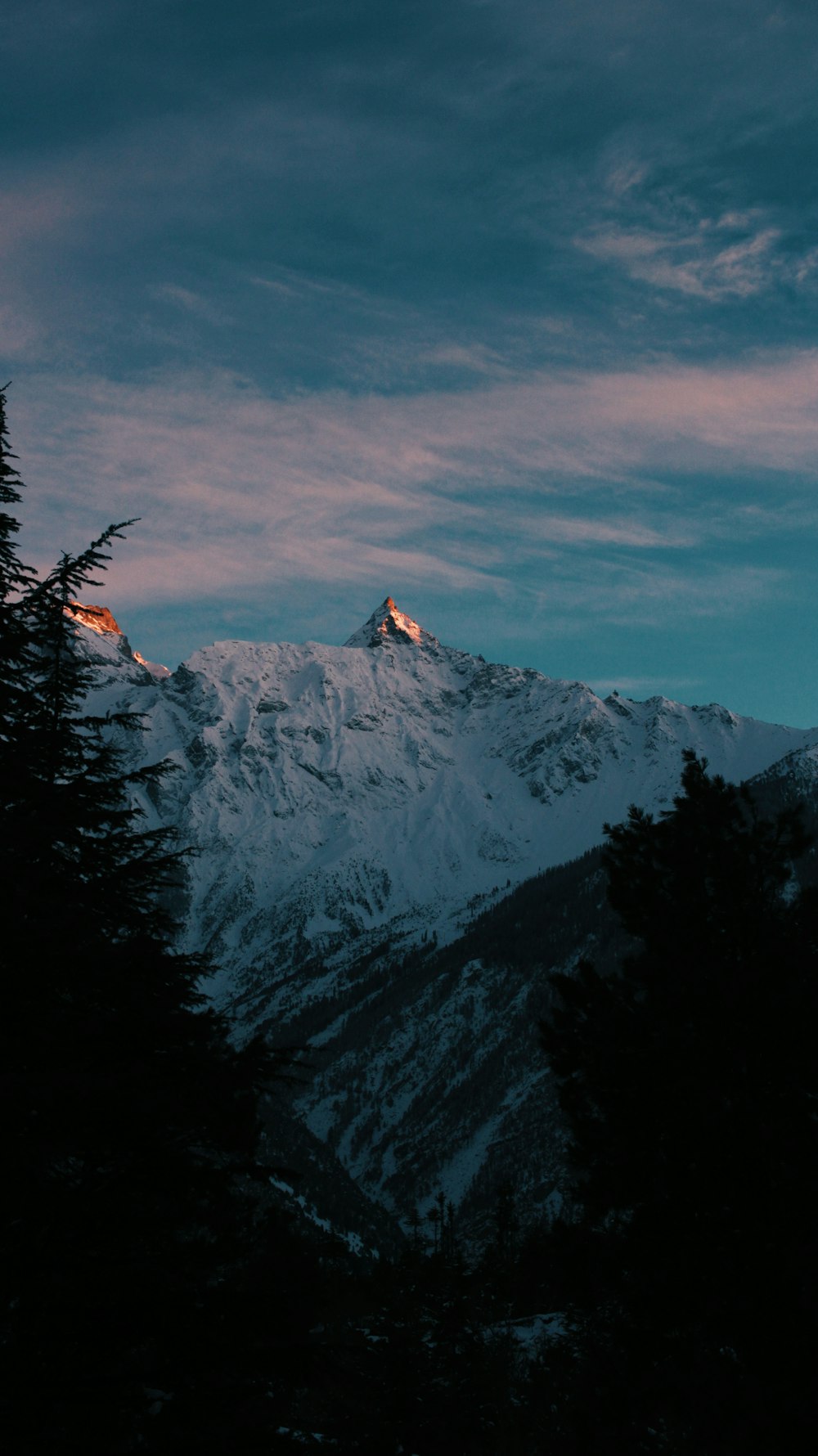 mountain covered by snow during daytime