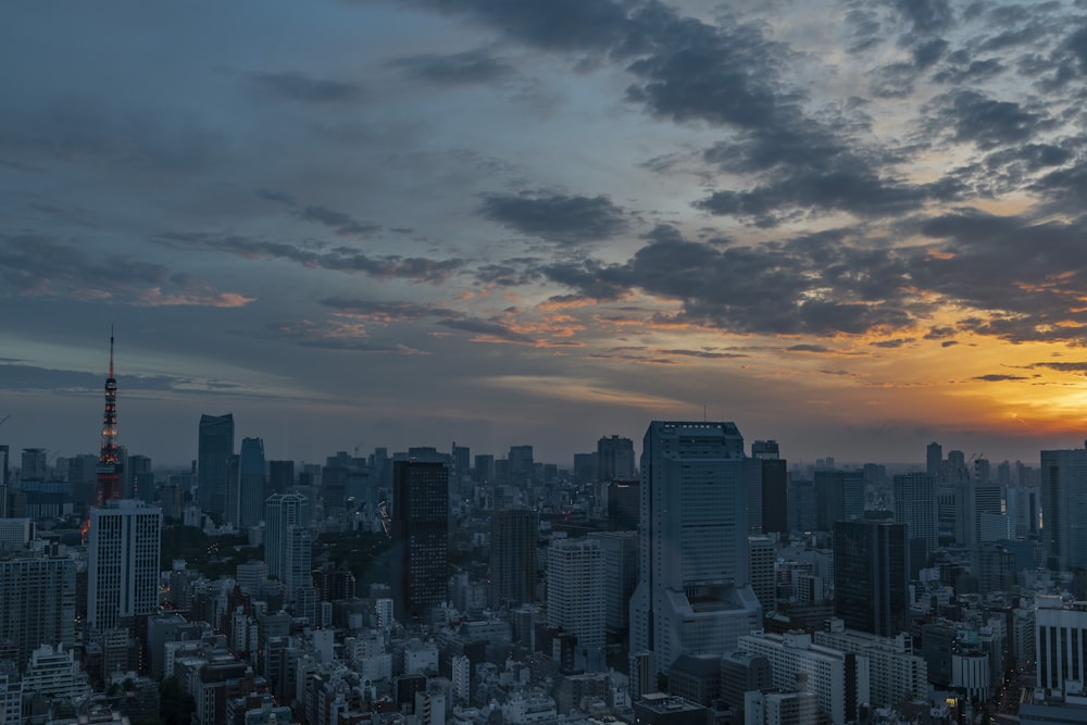 high rise building under grey clouds