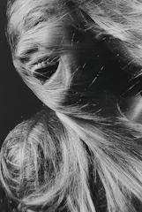 Dynamic black and white portrait of a fitness influencer in motion, embodying energy and authenticity.