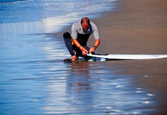 man holding surf board