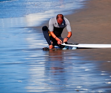 man holding surf board