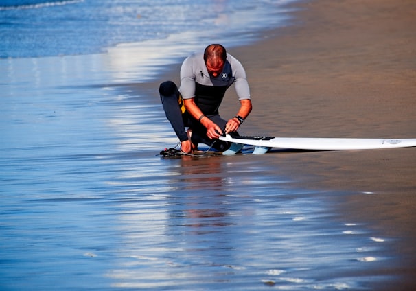 man holding surf board