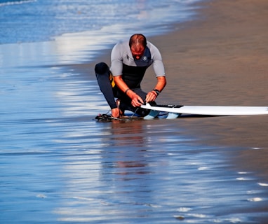 man holding surf board