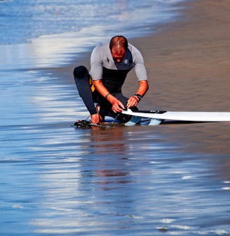 man holding surf board