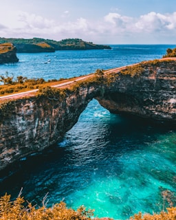 brown and gray bridge at middle of sea